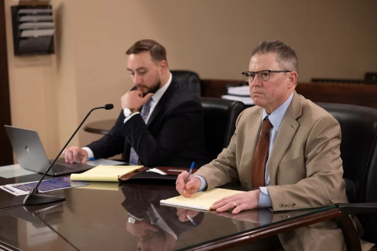 Two criminal defense lawyers in an office