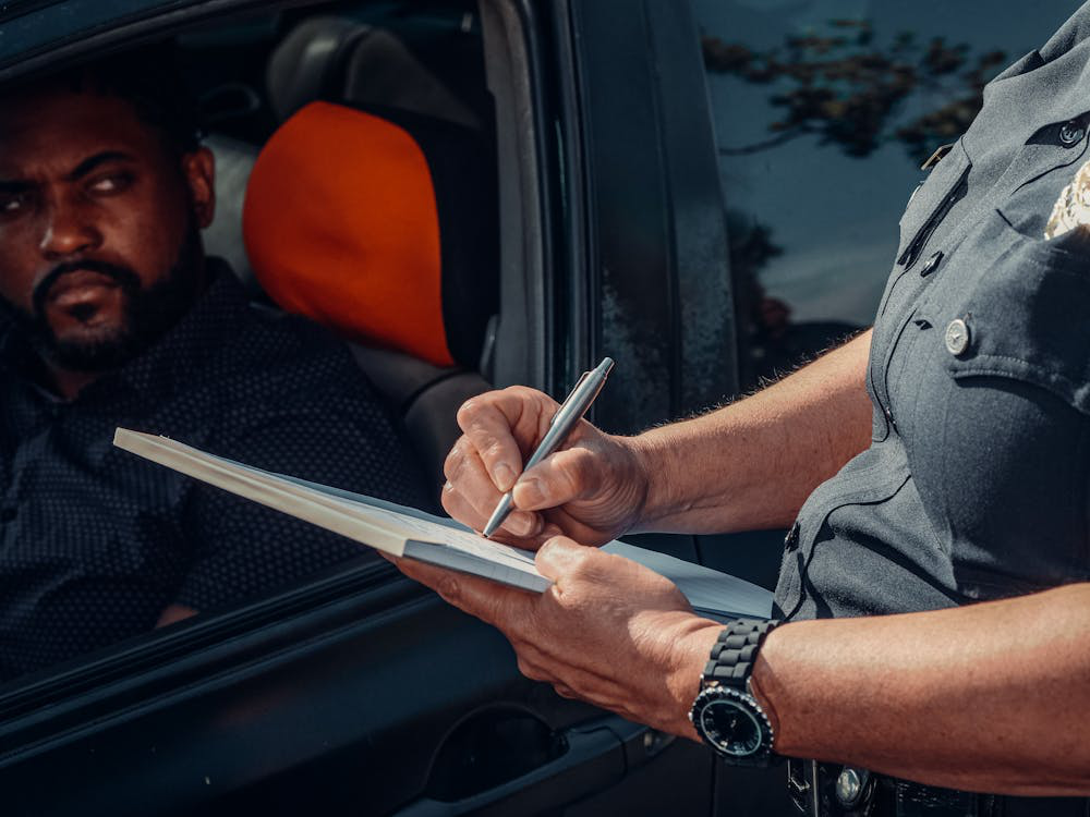 A police officer writing on a notepad