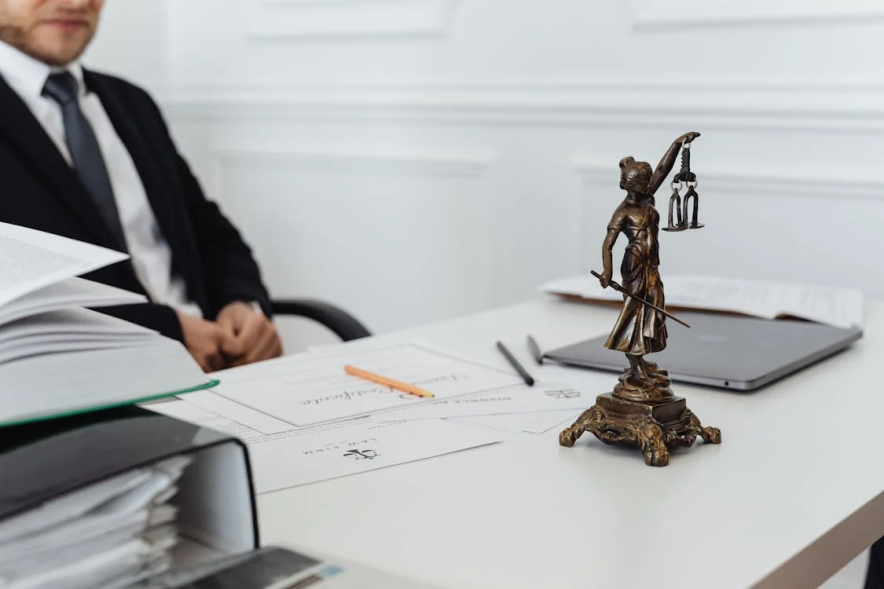 An image of a defense attorney behind his desk