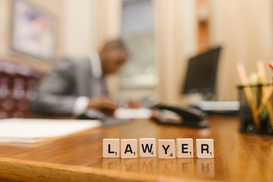 An image of Scrabble tiles on a table    