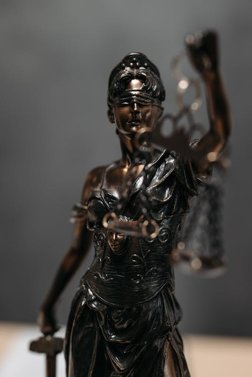 An image of a lady justice statuette