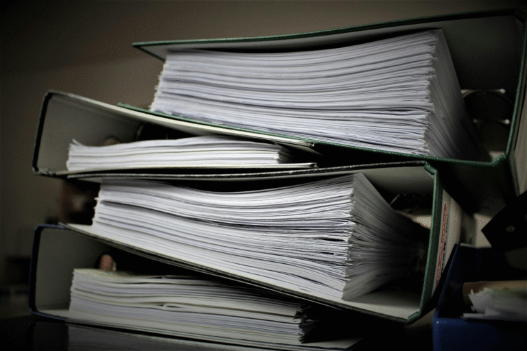 A photo showing a pile of folders