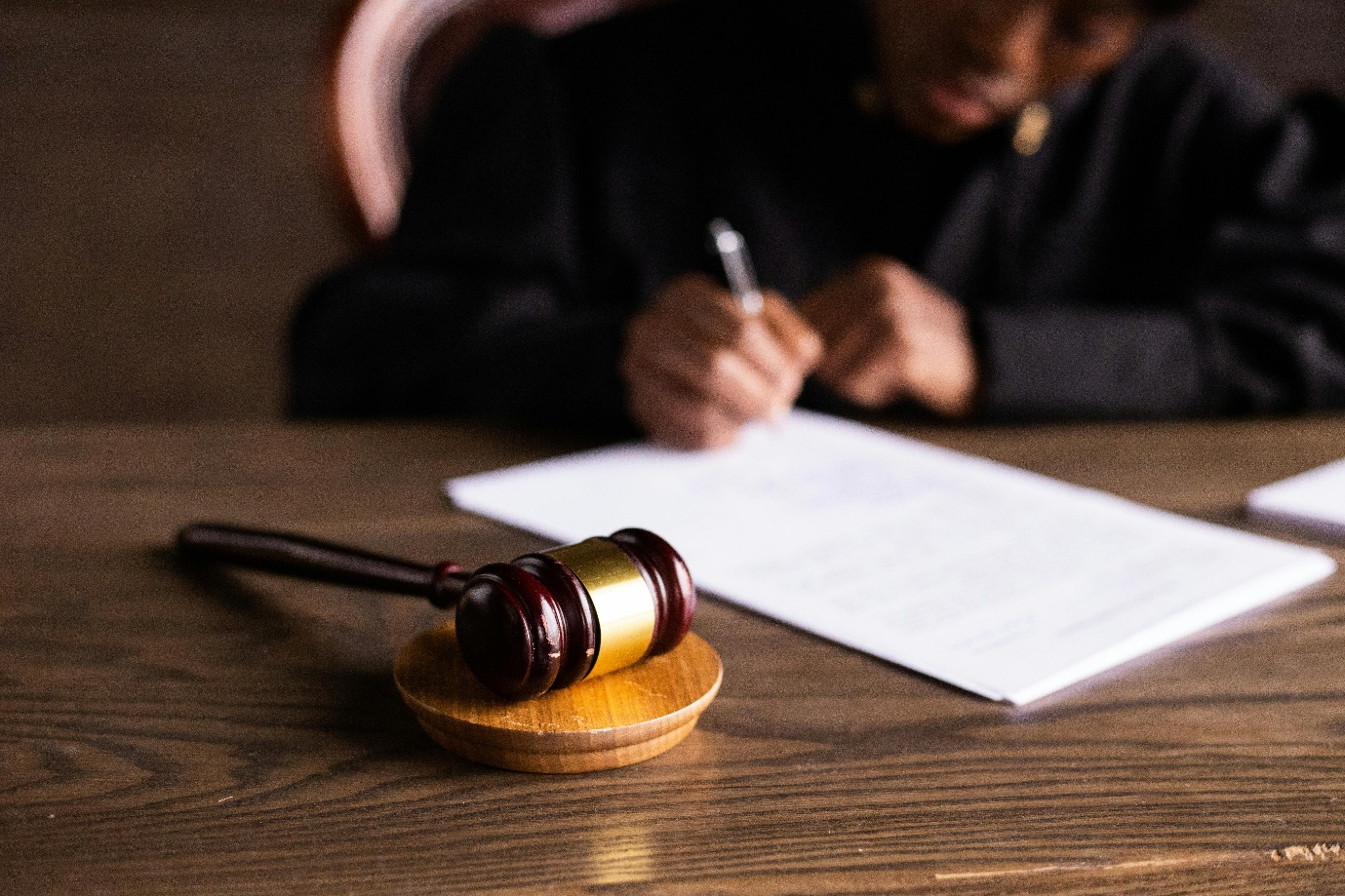 A photo showing a wooden gavel on a table