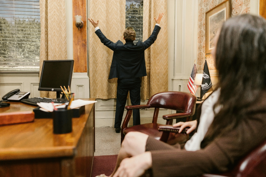A photo showing a person standing in an office