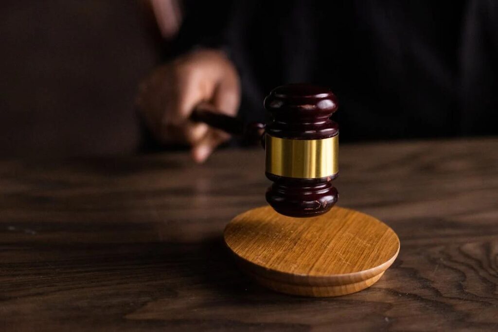 a person holding a gavel.
