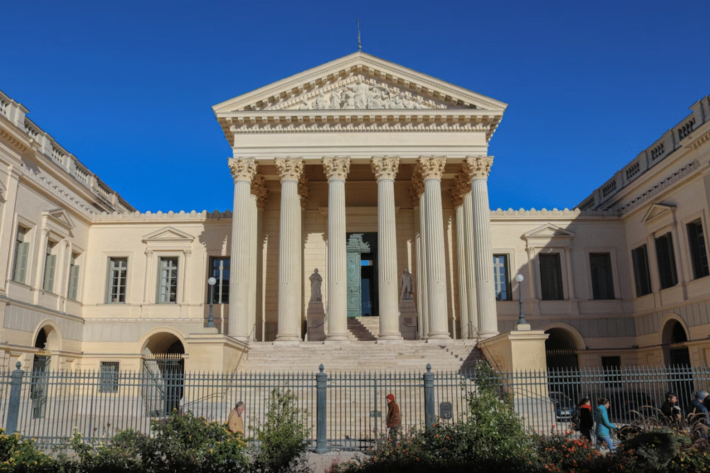 Large courthouse building with a fence in front
